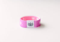 WWJD Purple Reversible Elastic Fabric Bracelet