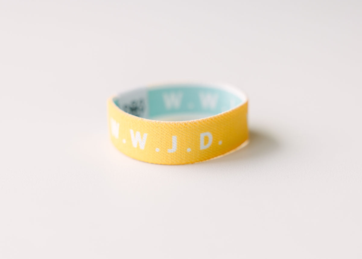 WWJD Yellow Reversible Elastic Fabric Bracelet