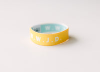 WWJD Yellow Reversible Elastic Fabric Bracelet