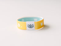 WWJD Yellow Reversible Elastic Fabric Bracelet