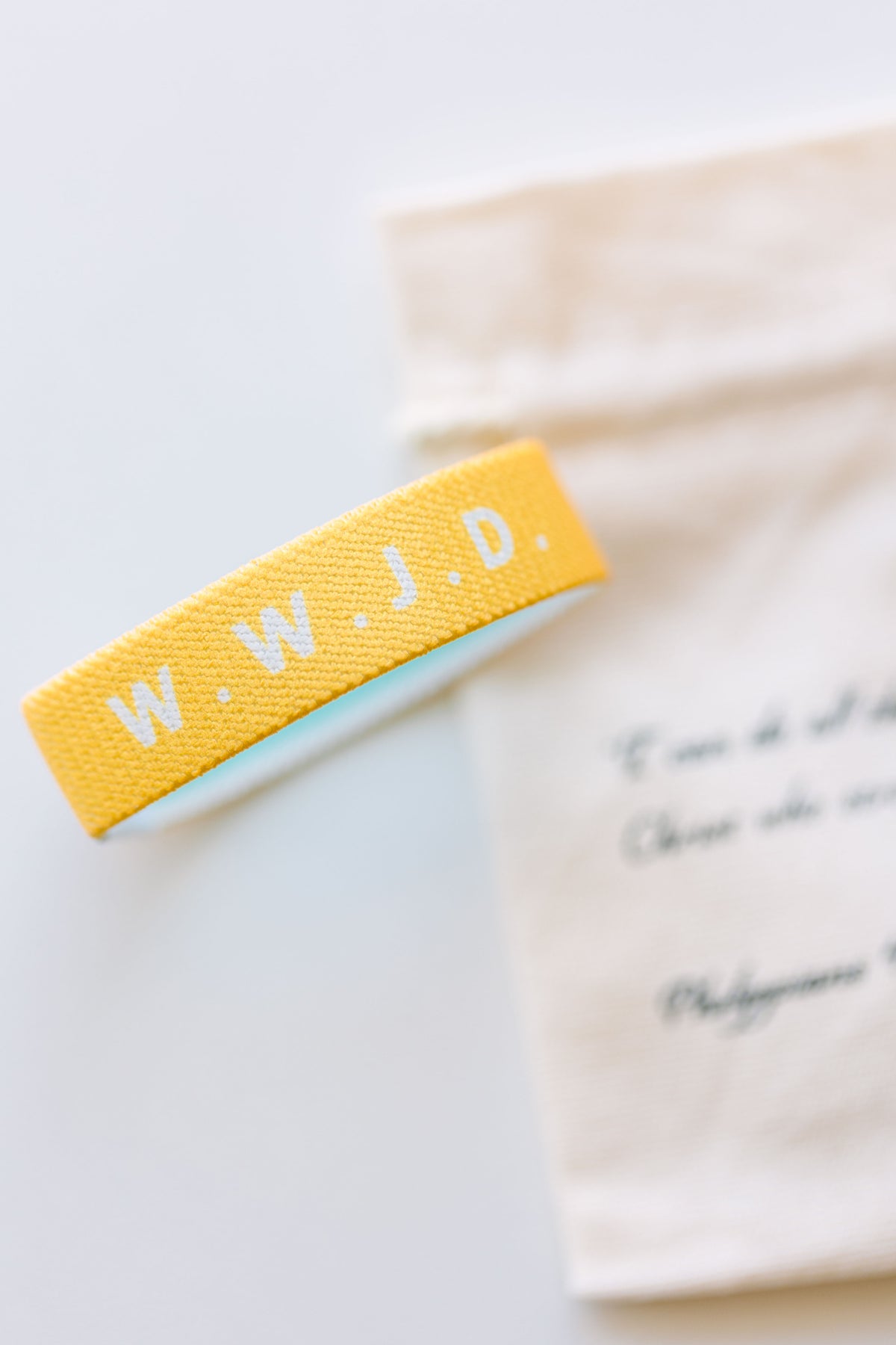 WWJD Yellow Reversible Elastic Fabric Bracelet
